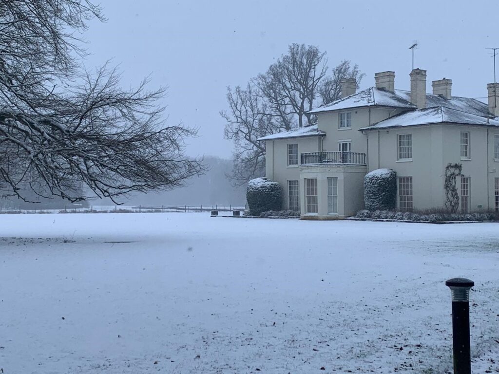 Christmas hotel breaks in Norfolk, Congham hall covered in a white sheet on snow